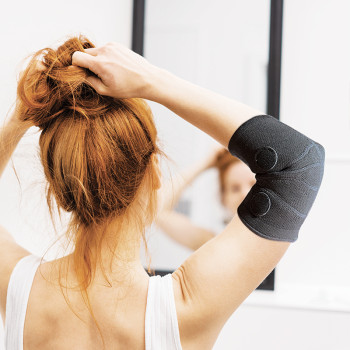 Magnetic elbow support to help relieve tendonitis - Auris